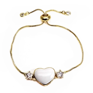 Detail of adjustable gold box chain bracelet with heart stone and star accents