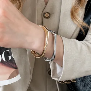 Elegant gold and silver chunky irregular geometric metal bangles for a modern look