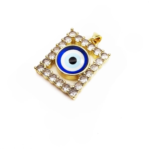 Close-up of square golden evil eye pendant with sparkling pavé zircon gemstones