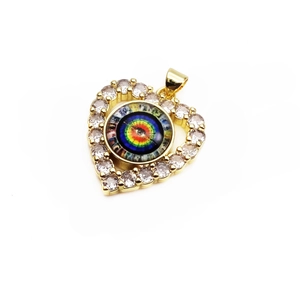 Macro detail of gold heart evil eye pendant with rainbow center and white cubic zirconia