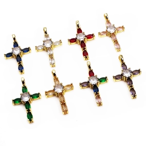 Detail of eight small colorful cross pendants with gold plating and cubic zirconia stones