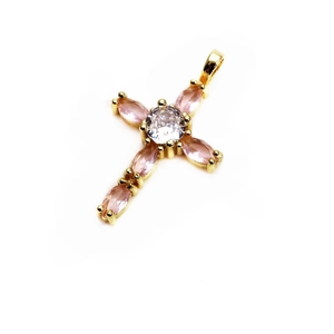Macro detail of copper cross pendant with pink marquise and white center zircon