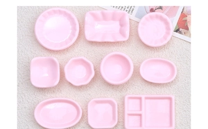 Detailed collection of miniature pink resin tableware sets with various glossy shapes