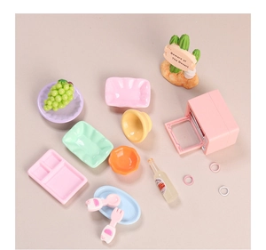 Detailed macro set of miniature dollhouse kitchen toys with tiny oven and colorful dishes
