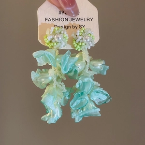 Handmade mint green beaded floral tassel earrings with waterfall fabric flowers for summer