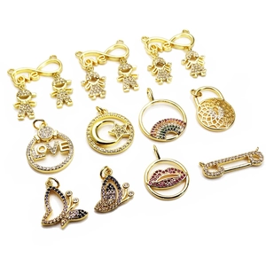 Collection of gold micro-pave zircon charms featuring butterfly, moon and love designs