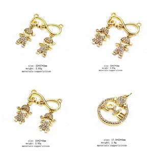 Detail view of gold-plated Love charms with micro-pave zircons and cartoon figures