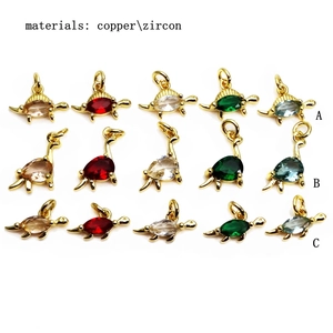 Golden copper dinosaur and turtle charms inlaid with colorful zircon stones in five shades