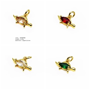 Macro detail of turtle charms in gold finish with colorful zircon stones 15x16mm