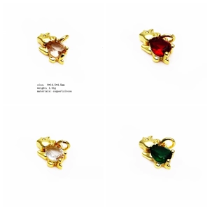 Detail view of 9x14.5mm dinosaur charms in zircon and copper with four color options