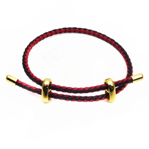 Detail of adjustable 3mm braided cords with polished gold slides and metal end caps
