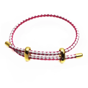 Detail of red and white braided 3mm cord bracelet with adjustable gold metal sliders
