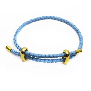 Close-up of sky blue 3mm braided leather cord bracelet with adjustable gold slides