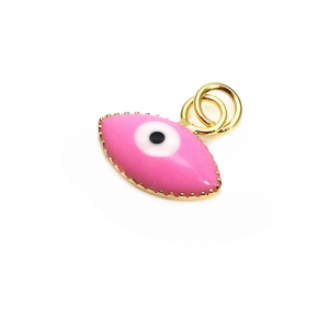 Detail of pink enamel evil eye pendant with gold-plated edges for jewelry making