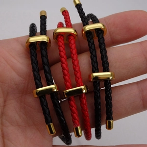 Detail of 3mm braided leather cord bracelet with golden adjustable figure-8 clasp
