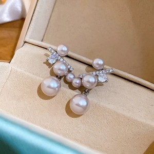 French vintage style pearl drop earrings with silver needle and cubic zirconia in beige box