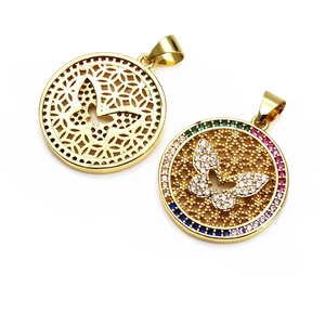 Macro detail of gold-plated butterfly pendants with multi-color stones and zircon inlay