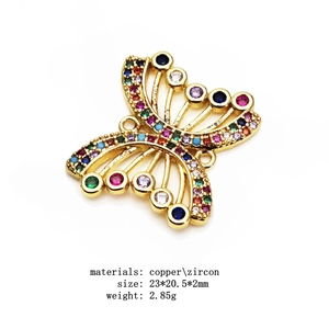 Macro view of colorful zircon pave butterfly connector in gold copper for DIY jewelry