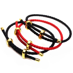 Close-up of 3mm braided leather cord bracelets with gold figure-eight buckles