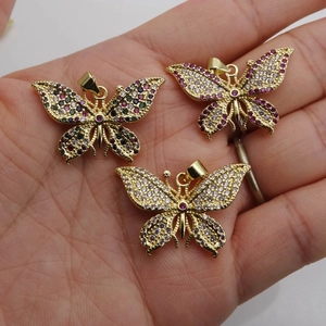 Micro-pave cubic zirconia butterfly pendants in colorful gradient stones and gold plating