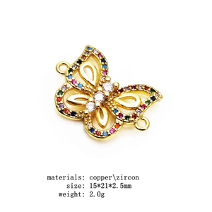 Macro view of colorful zircon butterfly connector in gold copper for DIY jewelry making