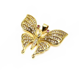 Detailed close-up of a golden butterfly pendant with micro-set zircons and red gem accents