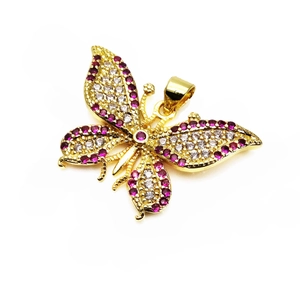 Detailed macro view of gold butterfly pendant with micro-paved cubic zirconia stones