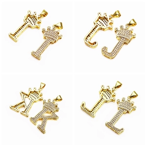 Macro shot of micro-paved zircon gold letters I-L with crown pendants detail