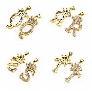 Macro view of gold-plated crown alphabet pendants Q R S T with micro-paved cubic zirconia