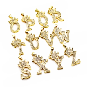 Gold-plated crown initial pendants with micro-paved zircons in a group grid display