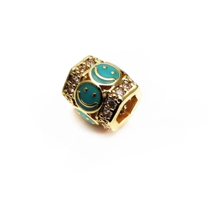 Macro view of a 14K gold-plated bead featuring micro-pave zircons and enamel smiley faces