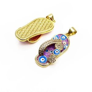 Rainbow enamel flip flop pendant with evil eye and gold plating in a detailed top view