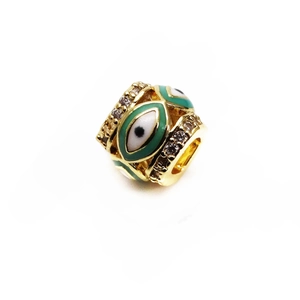 Macro detail of 14K gold plated evil eye bead with micro-pave crystals for DIY jewelry