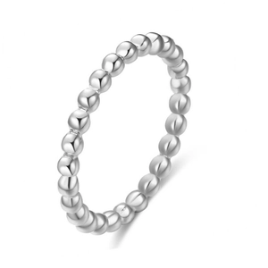 Close-up view of a minimalist 2mm beaded stainless steel ring with a polished silver finish