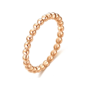 Detailed macro view of a 2mm rose gold beaded band ring made of polished stainless steel