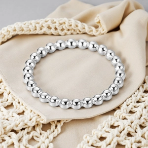 Detailed macro view of 2mm silver beaded ring crafted from durable stainless steel