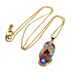 Gold flip-flop pendant necklace with red enamel, evil eye motifs and sparkling crystals