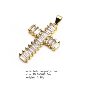 14K gold plated copper cross pendant with cubic zirconia inlay on white background