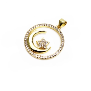 Detailed view of a gold-toned moon and star pendant encrusted with sparkling cubic zirconia