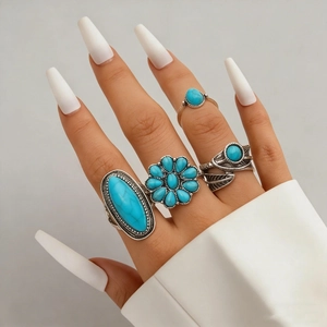 Bohemian vintage turquoise ring set featuring intricate leaf and flower silver designs