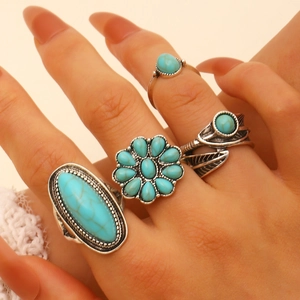 Vintage bohemian turquoise ring set featuring four antique silver geometric jewelry pieces