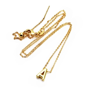 Detailed macro view of a 14K gold plated letter A pendant with a classic lobster clasp