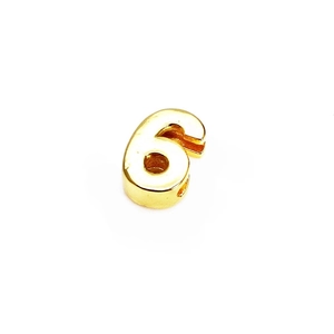 Detailed view of polished 14K gold plated number 6 bead for DIY jewelry making