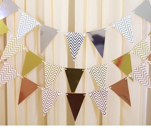 Detail of glitter and chevron gold triangle bunting banners for party decoration