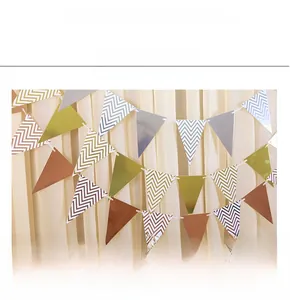 Close-up of metallic gold and silver bunting banners with chevron patterns for party decor