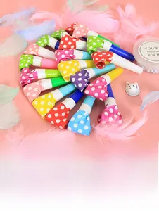 Colorful polka dot party blowouts in assorted colors arranged on pink background
