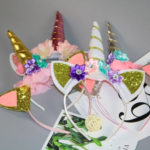 Glittery unicorn headbands with colorful silk flowers and mesh trim for girls birthday parties