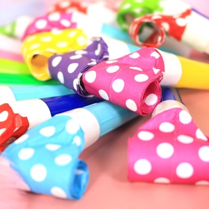 Colorful polka dot party blowouts and whistles in vibrant assorted colors for celebrations