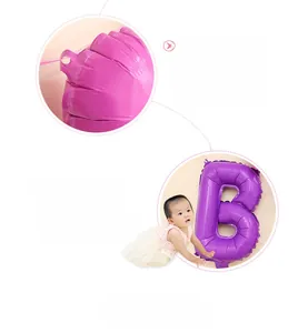 Detailed view of purple foil birthday balloon letter B with convenient hanging holes