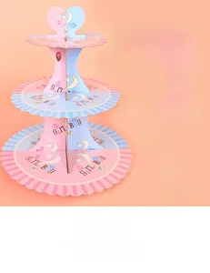 Detailed view of 3-tier gender reveal cupcake stand with pink and blue girl or boy design